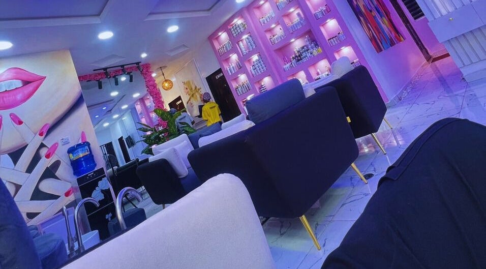 Modern interior of Xtragleam Aesthetic Clinic in Ishara, Ogun State, NG, featuring plush seating and vibrant decor.