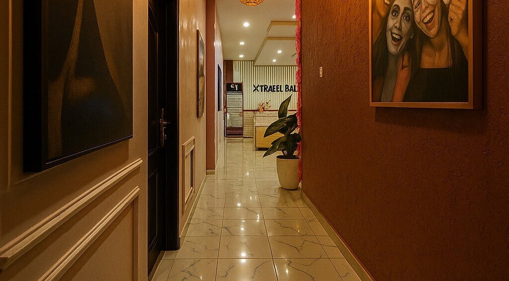 Elegant hallway at Xtragleam Aesthetic Clinic, Ishara, Ogun State, NG. Modern design with warm lighting.