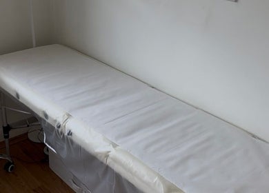Treatment bed in Allure Cosmetics, Luton, England, GB, offering serene wellness experiences.