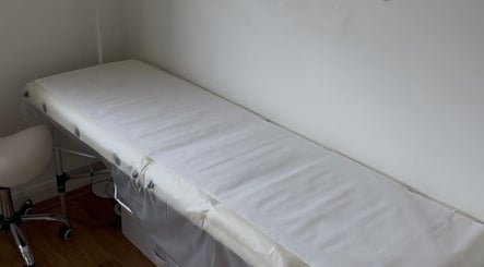Treatment bed in Allure Cosmetics, Luton, England, GB, offering serene wellness experiences.