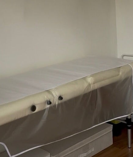 Therapy bed setup at Allure Cosmetics in Luton, England, GB for wellness treatments.