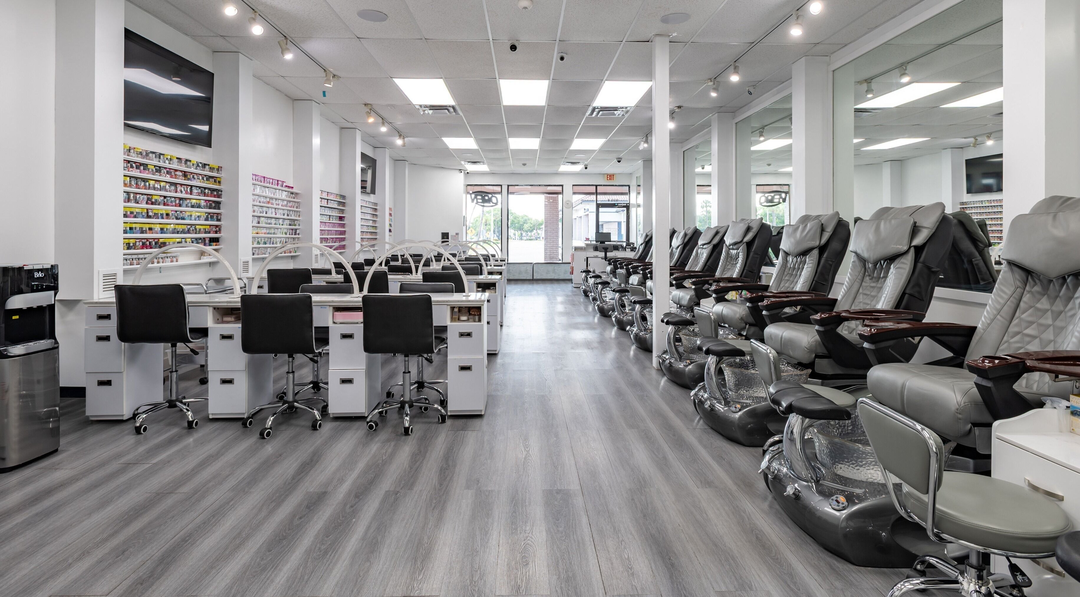 Interior of Lash & Nail Spa Hialeah showcasing modern nail stations and pedicure chairs in Hialeah, Florida, US.