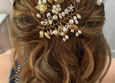 Intricate bridal hairstyle with pearls at F.P Hairdressing, Warfield, England, GB.