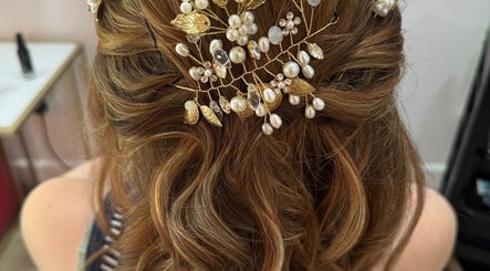 Intricate bridal hairstyle with pearls at F.P Hairdressing, Warfield, England, GB.