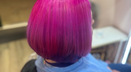 Vibrant pink bob hairstyle at F.P Hairdressing, Warfield, England, GB.