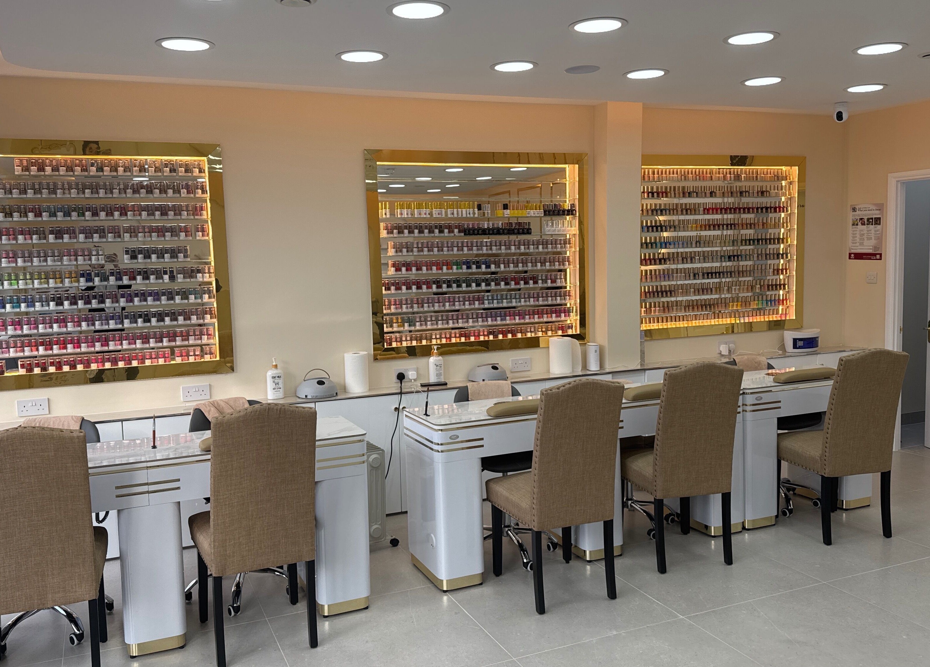 Elegant nail stations at Fancy Nails, London, England, GB, showcasing a wide polish selection.