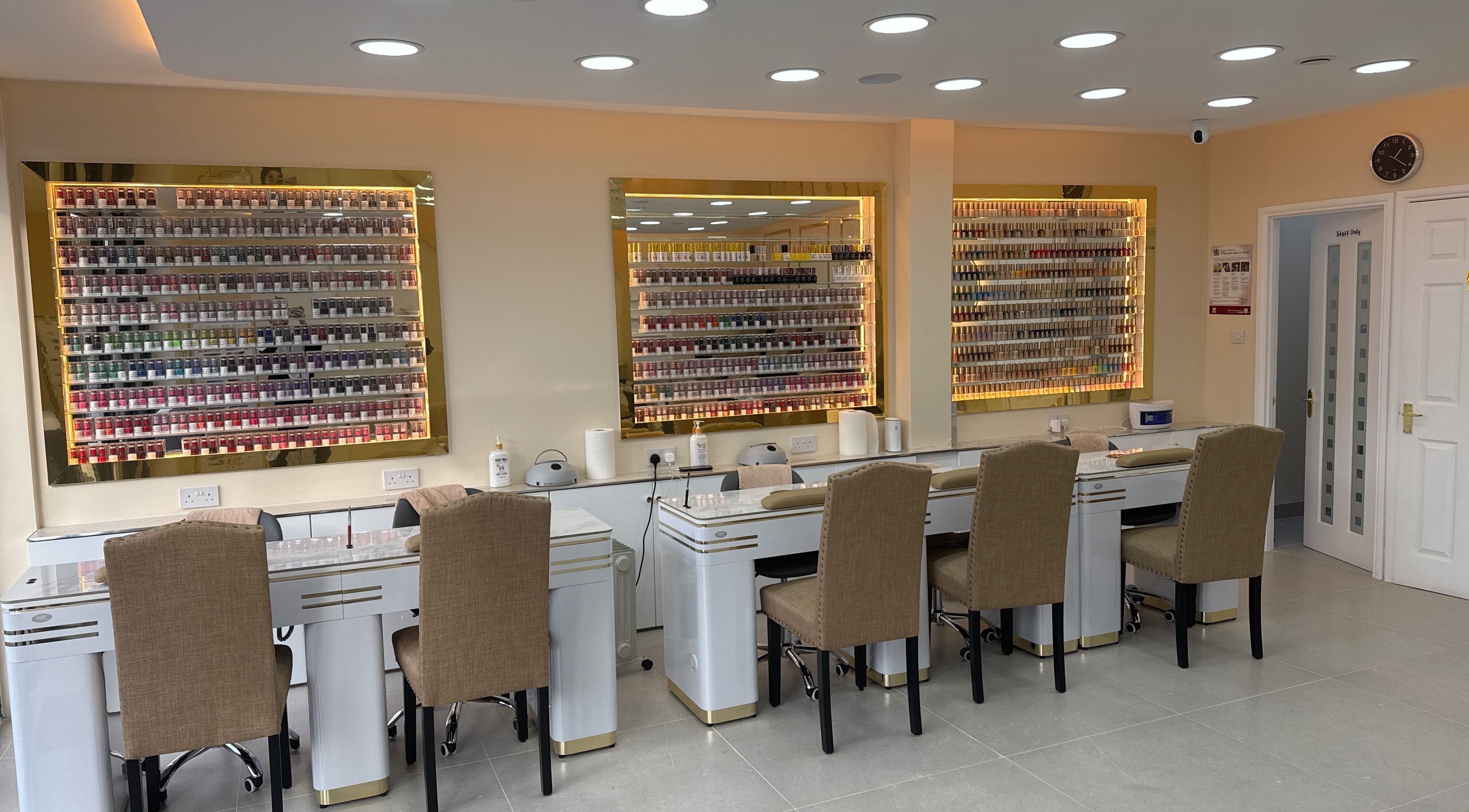 Elegant nail stations at Fancy Nails, London, England, GB, showcasing a wide polish selection.