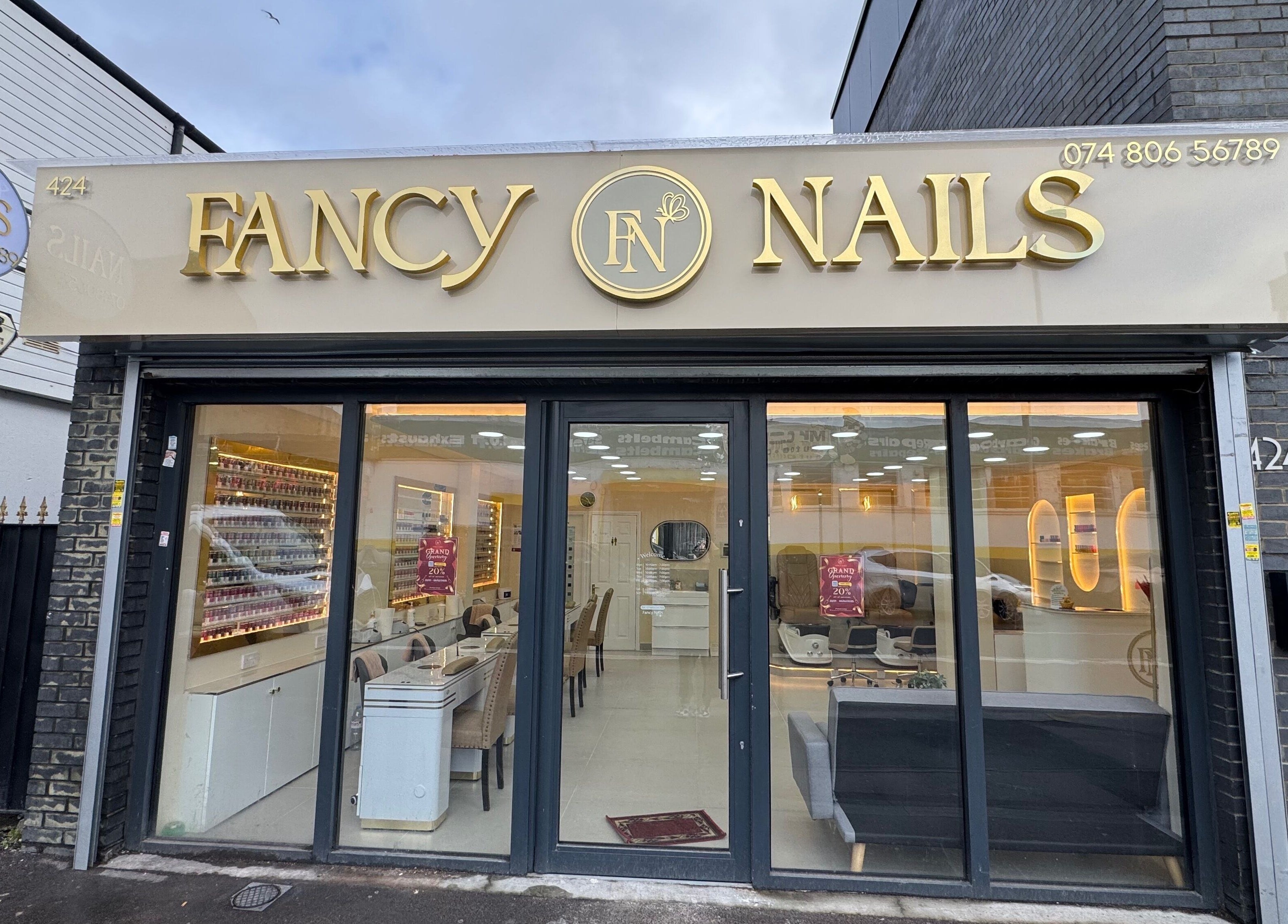 Front view of Fancy Nails in London, England, GB showcasing elegant signage and inviting entrance.