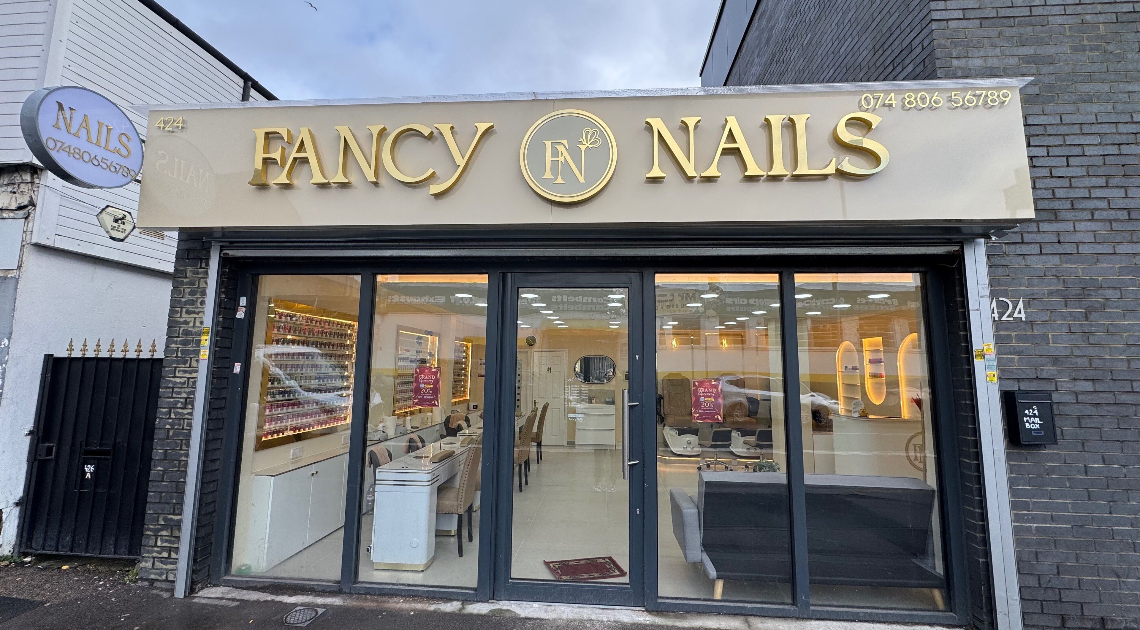 Front view of Fancy Nails in London, England, GB showcasing elegant signage and inviting entrance.