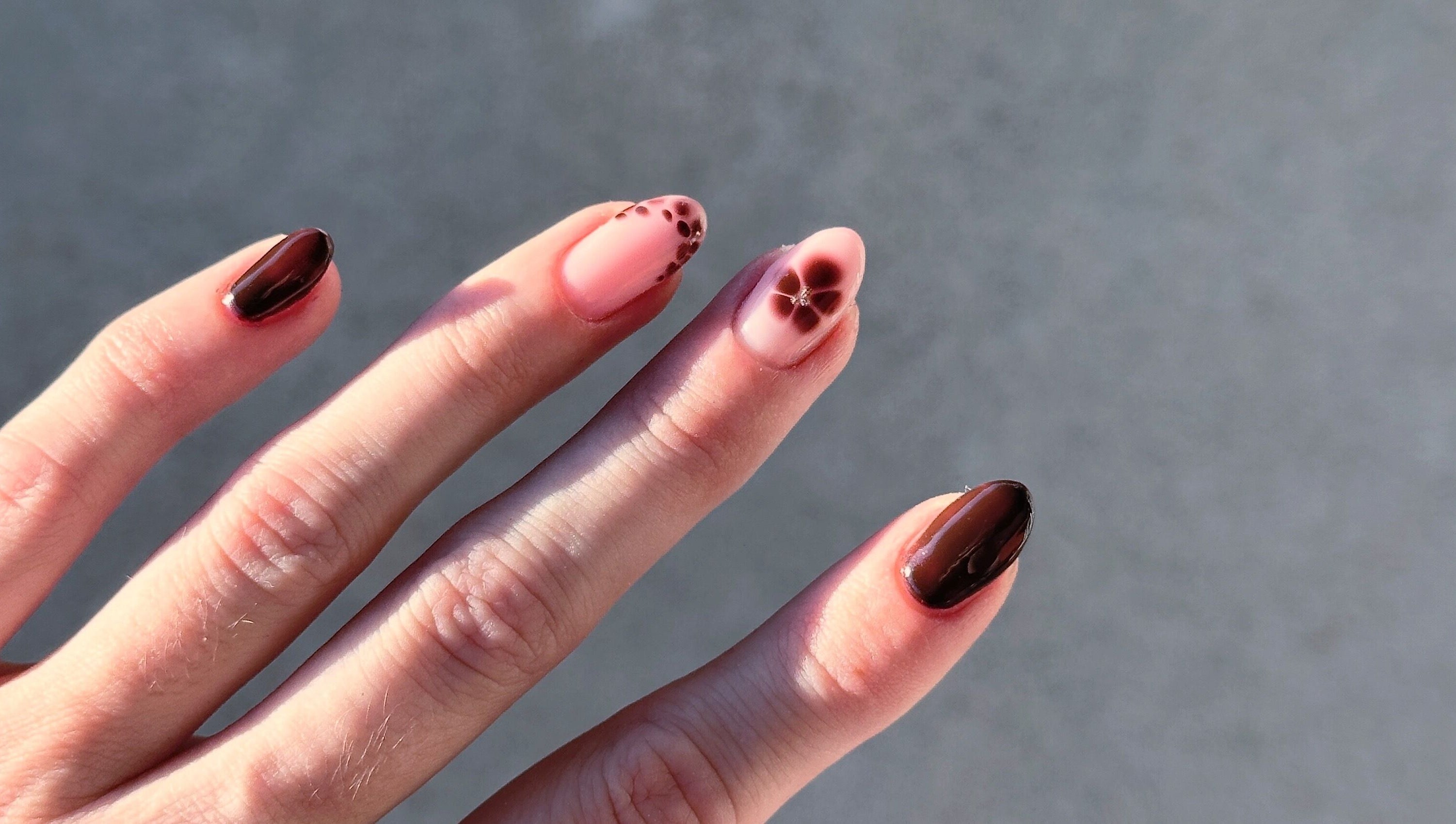 Elegant floral nail art by Butter Nails, Hamilton, Waikato, NZ, showcasing rich brown and pink tones.