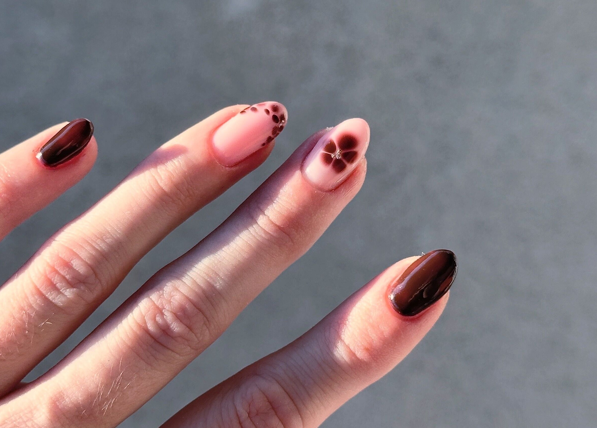 Elegant floral nail art by Butter Nails, Hamilton, Waikato, NZ, showcasing rich brown and pink tones.