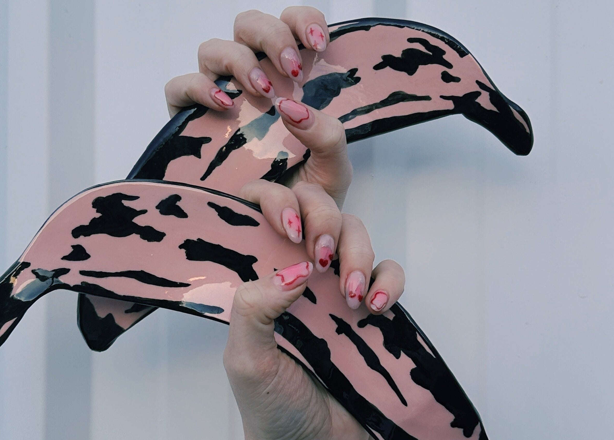 Creative nail art design at Butter Nails, Hamilton, Waikato, NZ, featuring unique pink and black patterns.