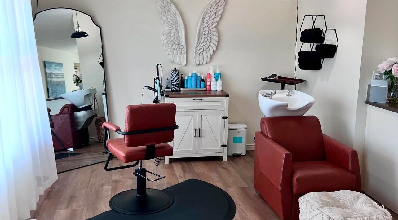 Modern salon with styling chair at Sunset Styling Co in Cochrane, Alberta, CA, featuring elegant decor.