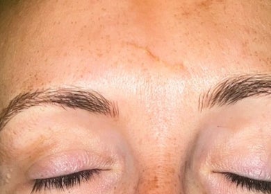 Close-up of relaxed face with groomed eyebrows at Beauty Custom Club Massage Studio, Benton, England, GB.