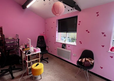 Charming pink interior at Nail-Licious by Emilia in Godmanchester, England, GB featuring heart details and cozy decor.