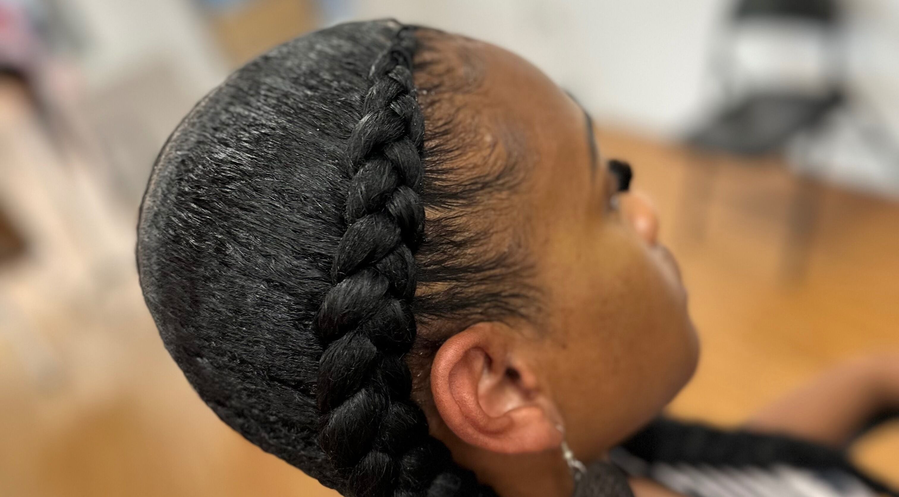 Intricate braid design at Fashion Hair Braiding, Arlington, Texas, US showcasing expert hairstyling.