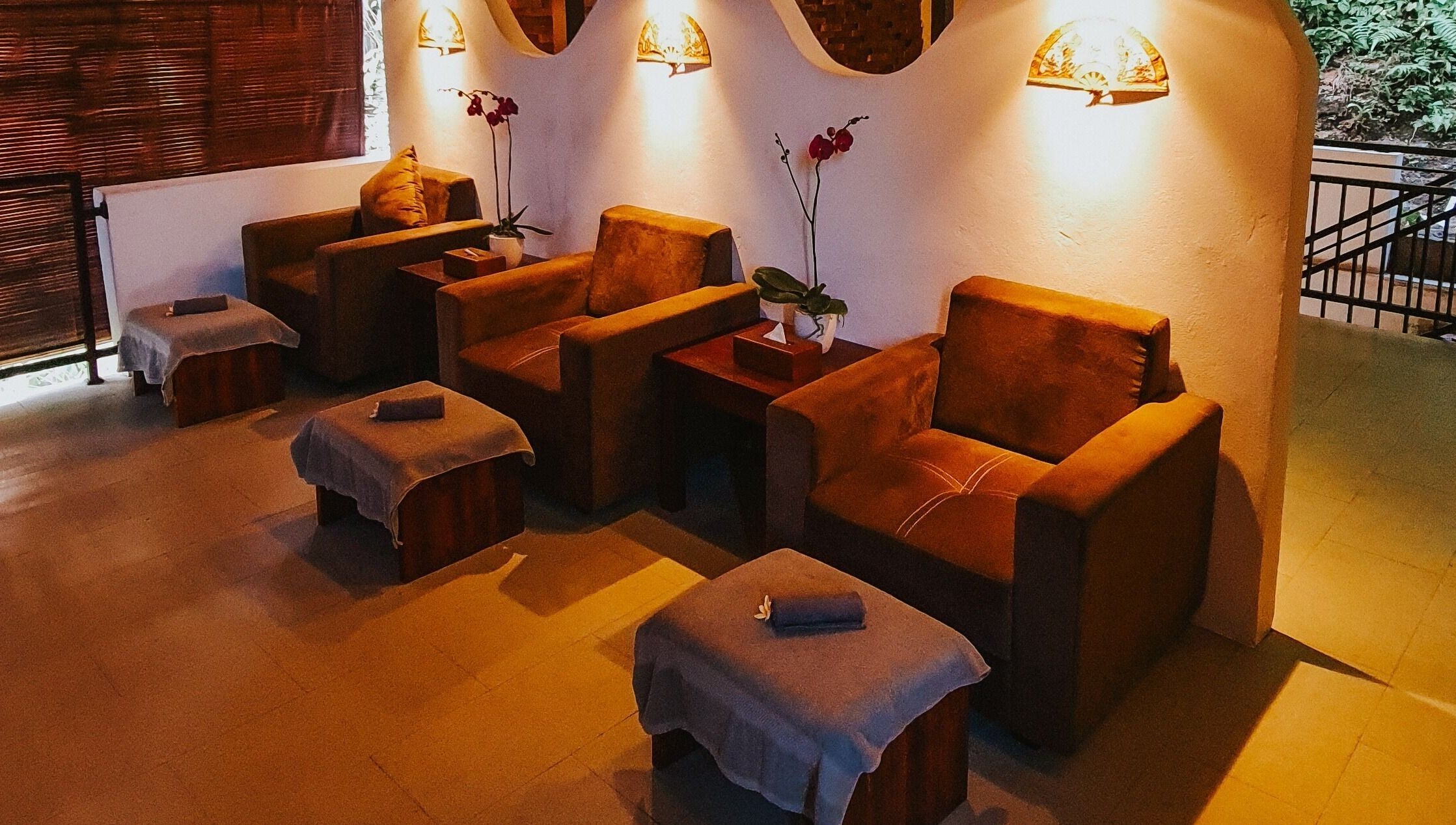 Comfortable seating at Sarira Healing Spa, Bali, Bali, ID provides a relaxing ambiance with warm lighting.