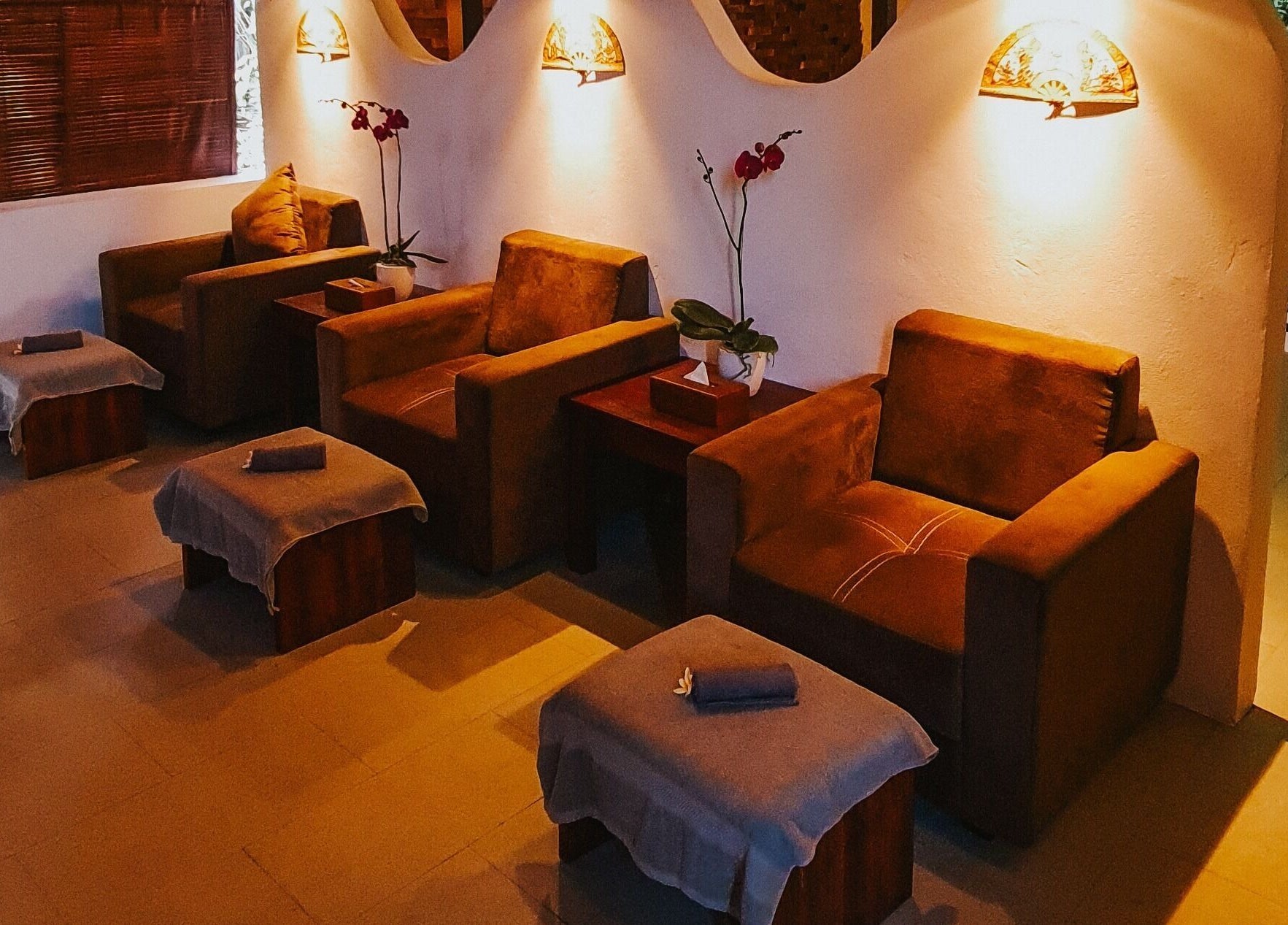 Comfortable seating at Sarira Healing Spa, Bali, Bali, ID provides a relaxing ambiance with warm lighting.