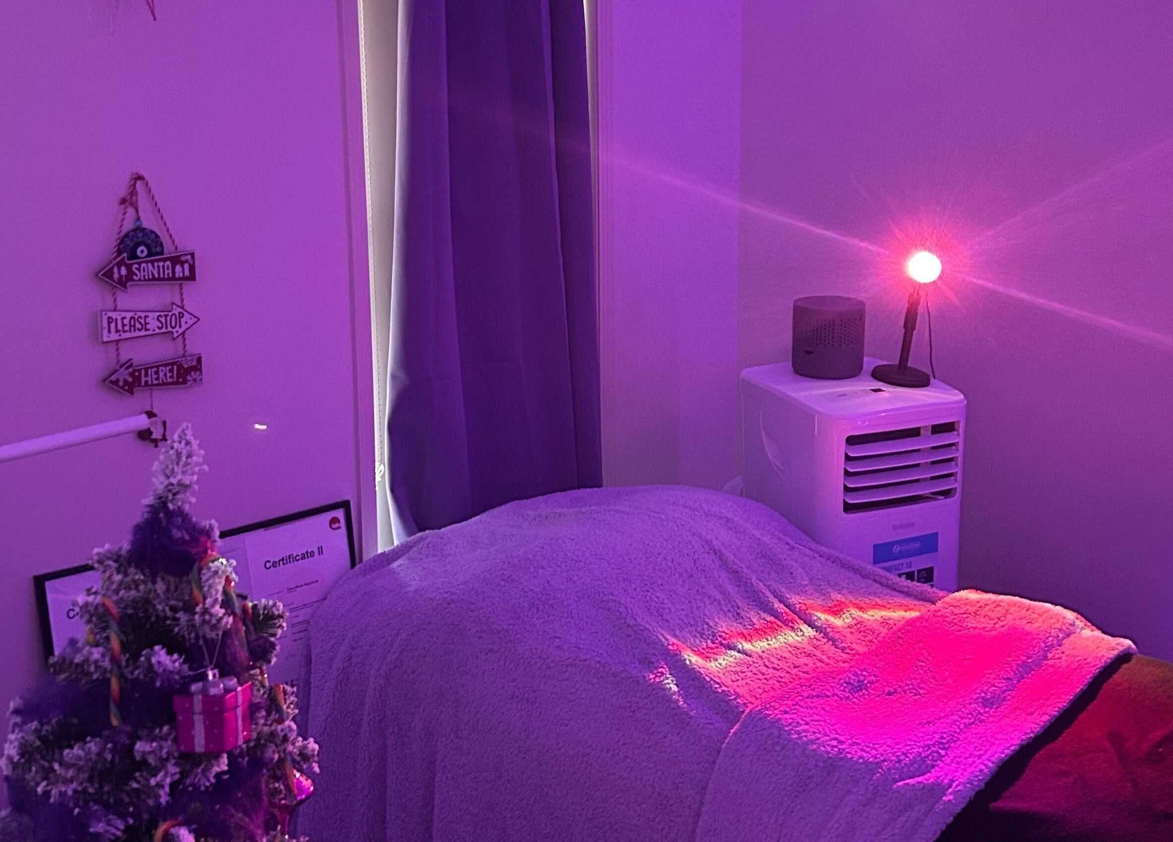 Tranquil treatment room at Glamor Beauty Bar, Meridan Plains, Queensland, AU with calming purple lights.