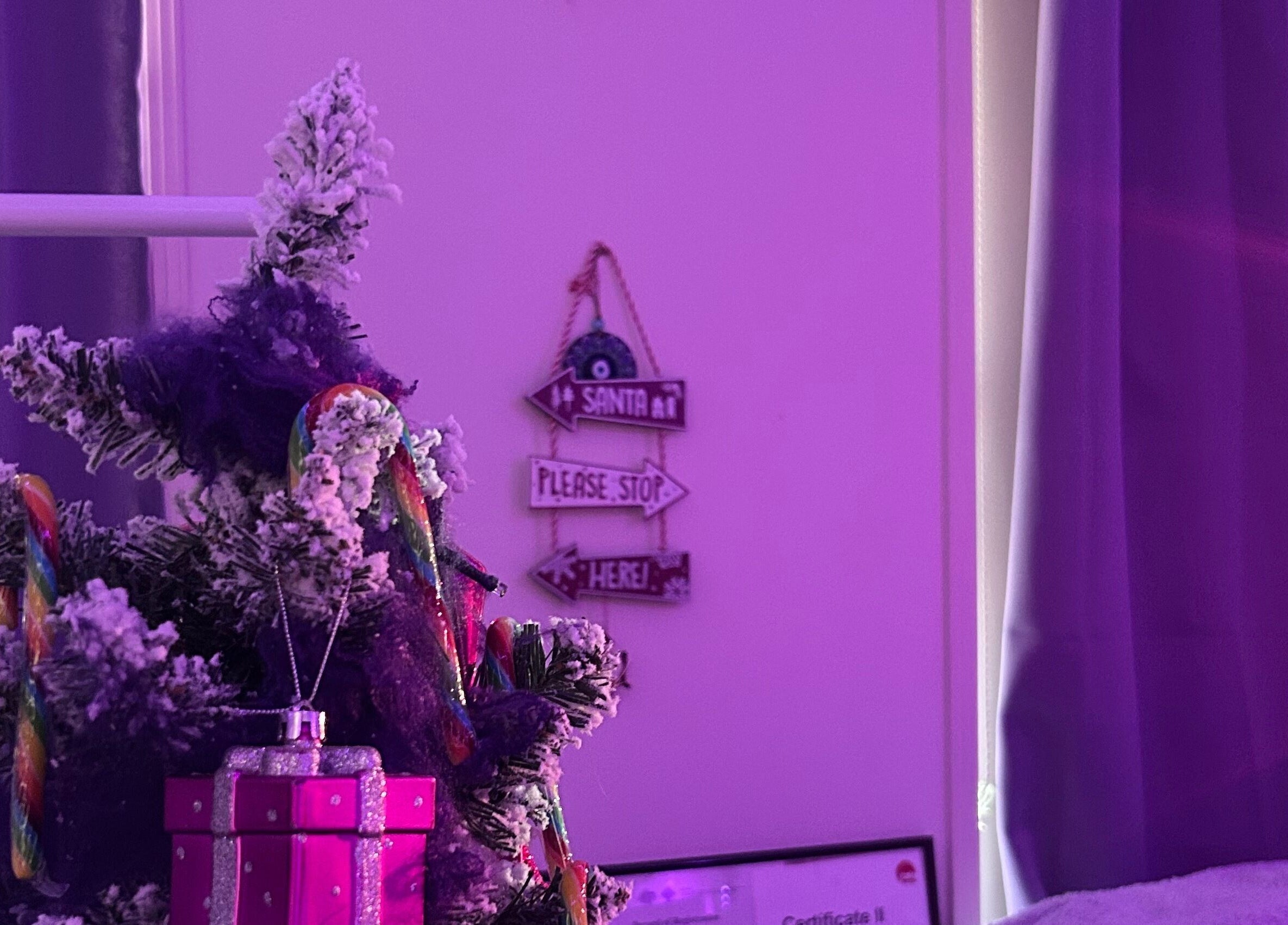Festive decor at Glamor Beauty Bar, Meridan Plains, Queensland, AU with a small tree and gift box.