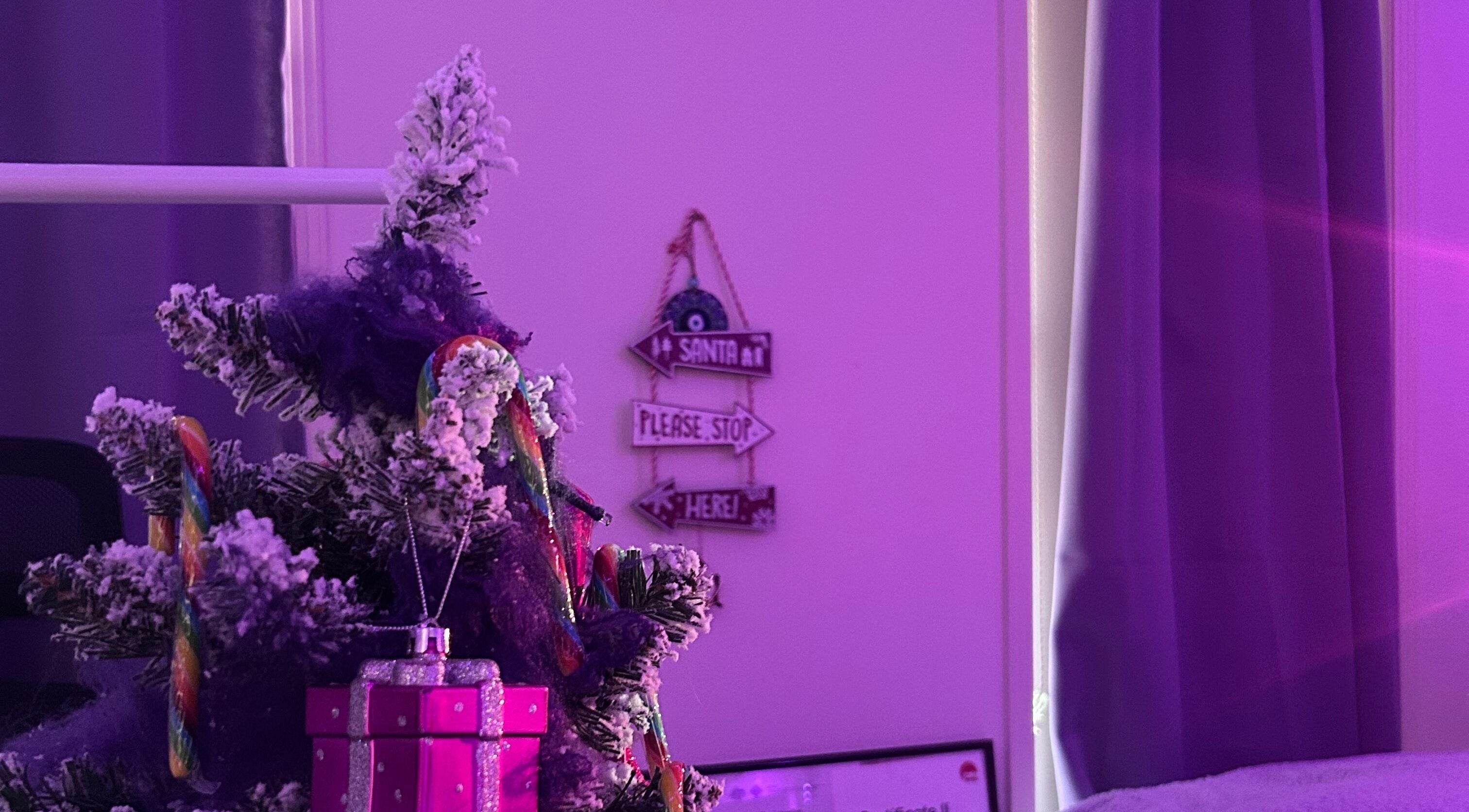 Festive decor at Glamor Beauty Bar, Meridan Plains, Queensland, AU with a small tree and gift box.