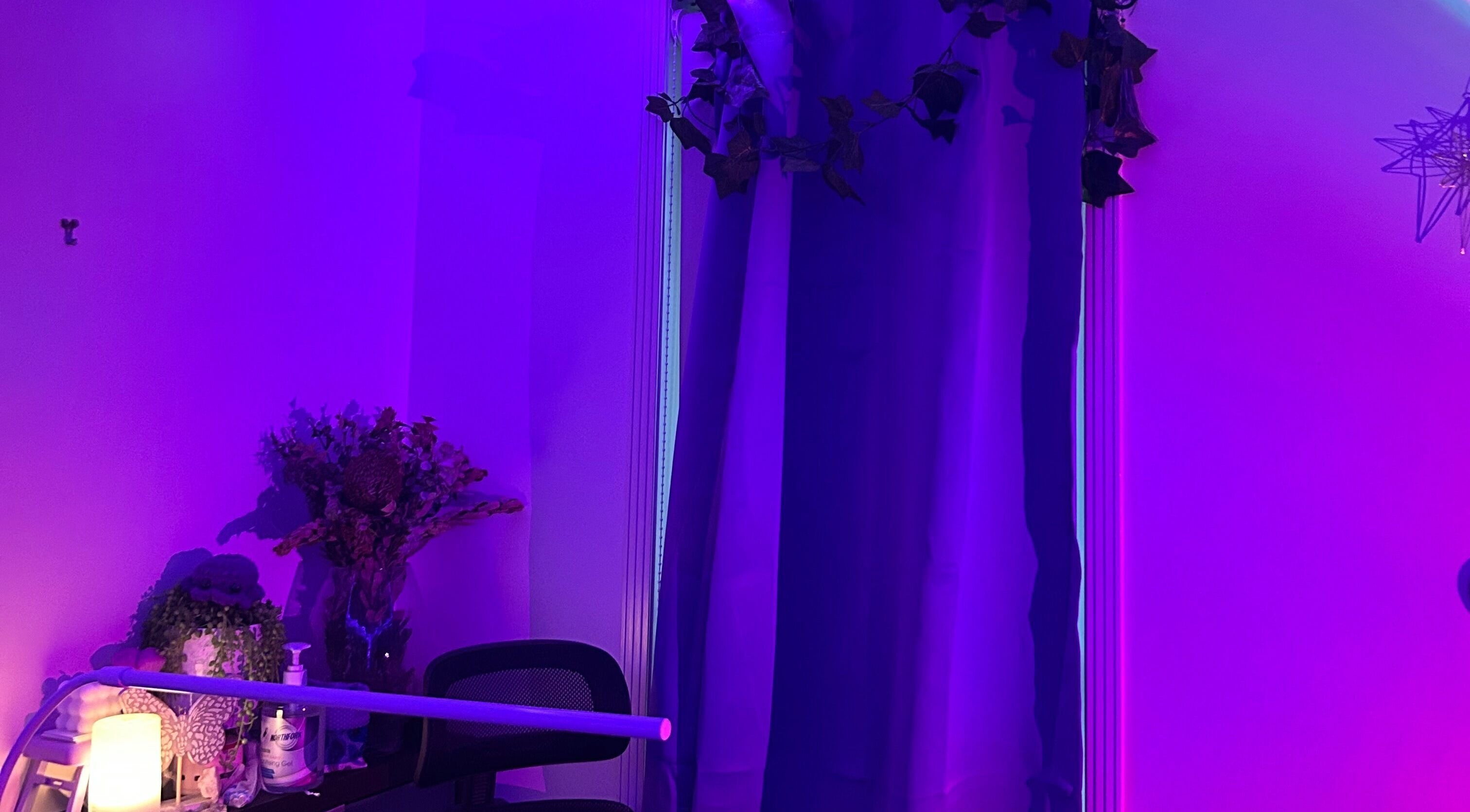 Relaxing purple-lit room at Glamor Beauty Bar in Meridan Plains, Queensland, AU with soothing decor and ambience.