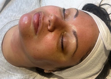 Relaxed woman enjoying facial treatment at Refresh Skin Therapy in Southampton, England, GB.