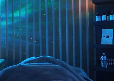 Relaxing room setup at Mind & Mane Head Spa, Watford, England, GB, with calming blue lighting and essentials.