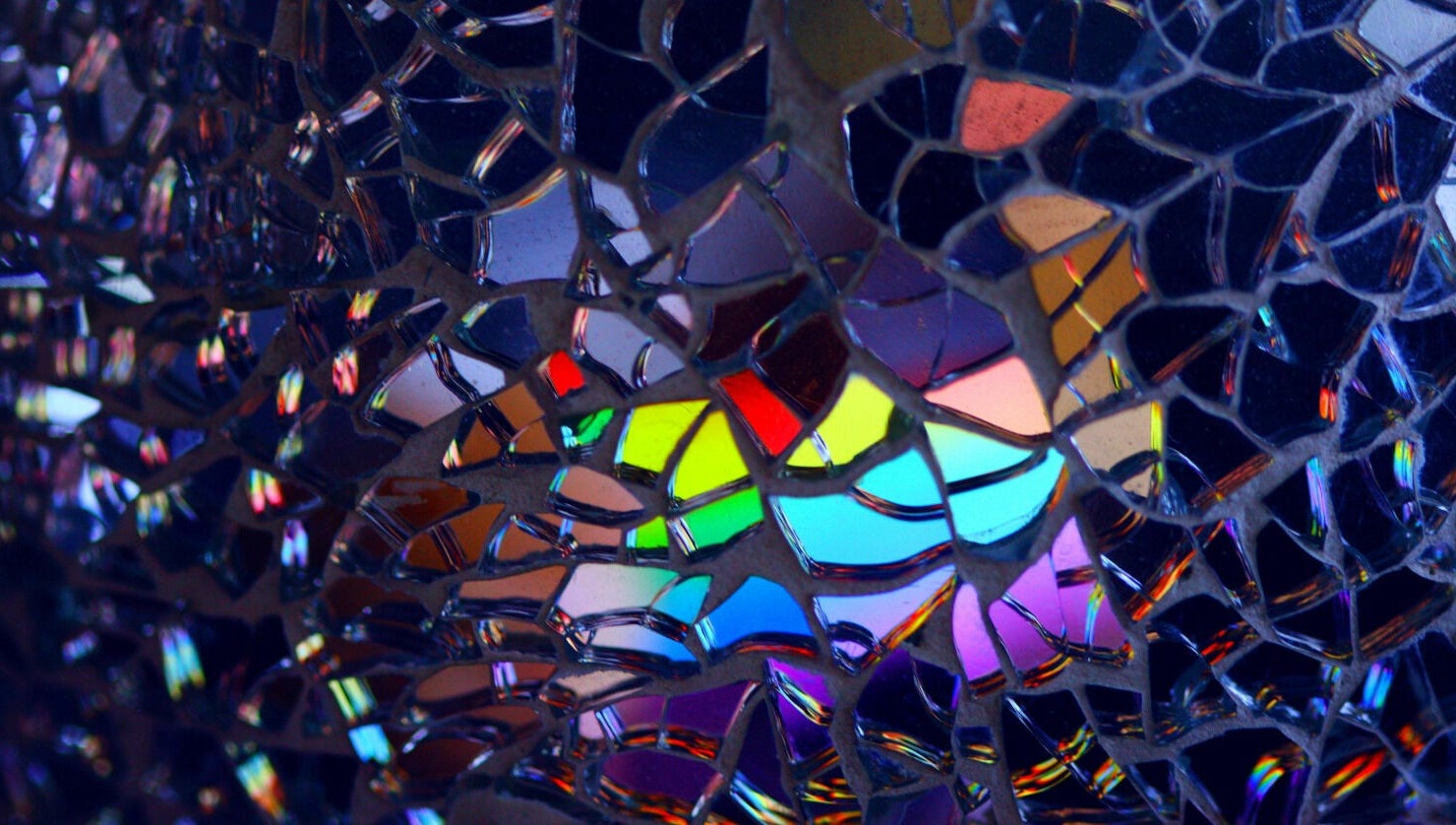 Colorful glass mosaic at Precision Pulse Electrolysis in Nashville, Tennessee, US enhances the serene atmosphere.