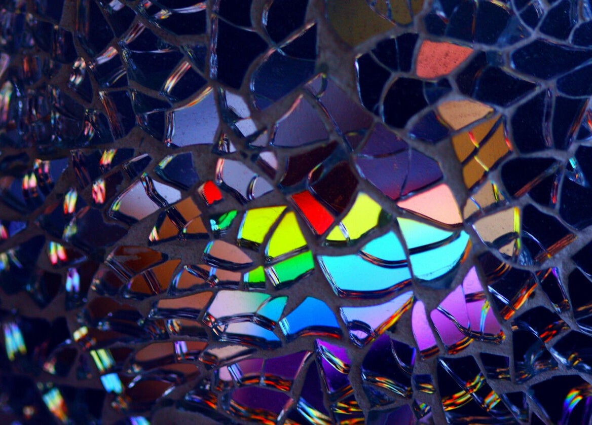 Colorful glass mosaic at Precision Pulse Electrolysis in Nashville, Tennessee, US enhances the serene atmosphere.