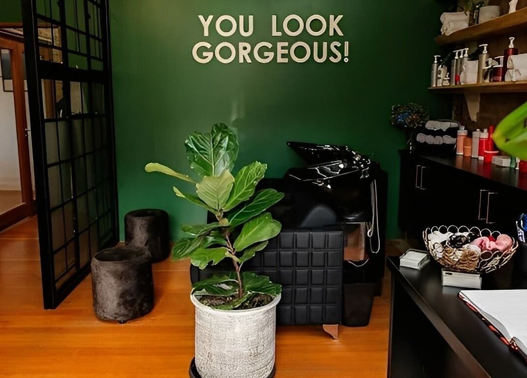 Stylish salon interior at Hair By Caryn Timms in Pietermaritzburg, Kwazulu-natal, ZA featuring green décor.