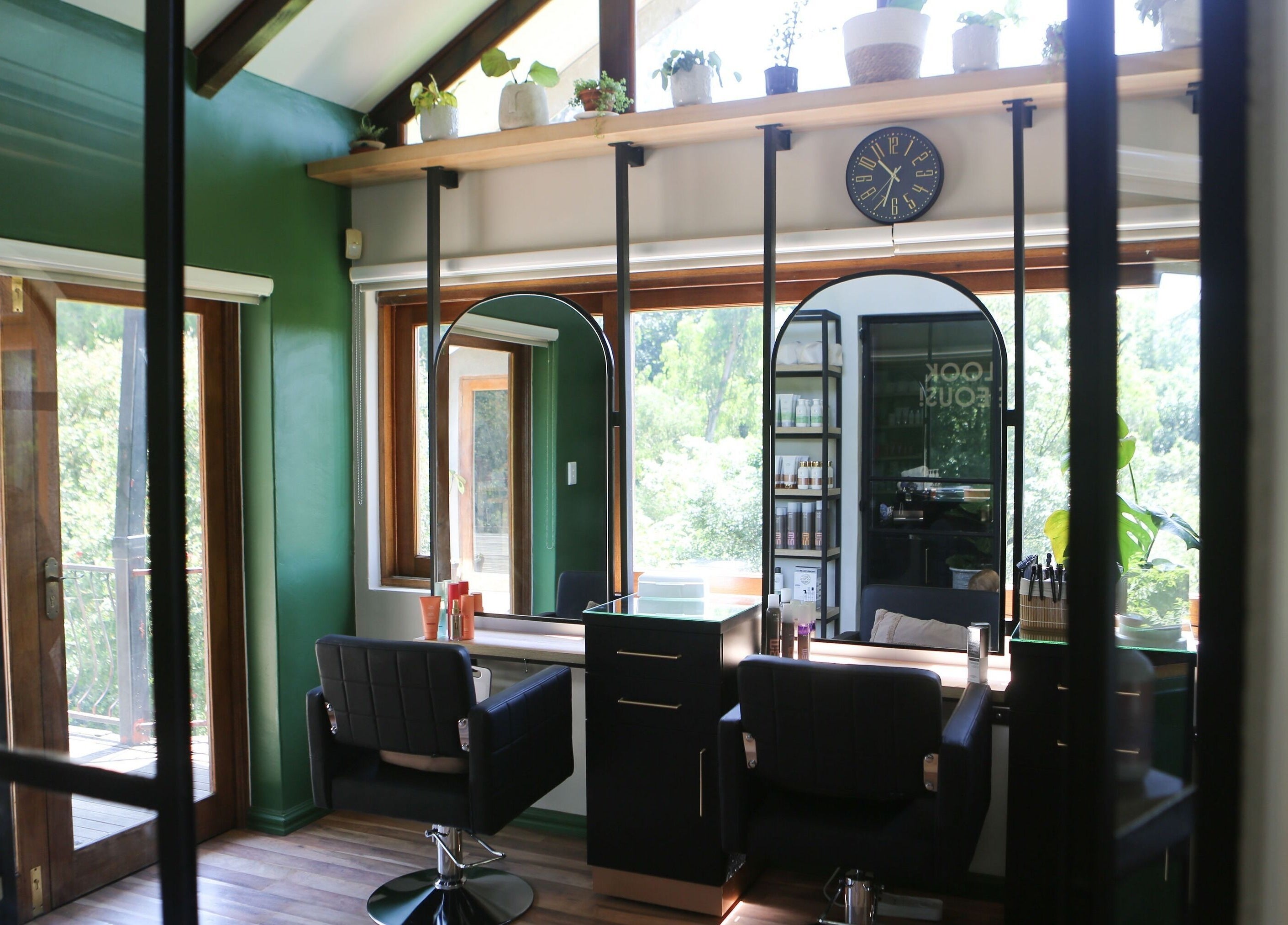 Stylish interior of Hair By Caryn Timms in Pietermaritzburg, Kwazulu-Natal, featuring chic salon chairs.