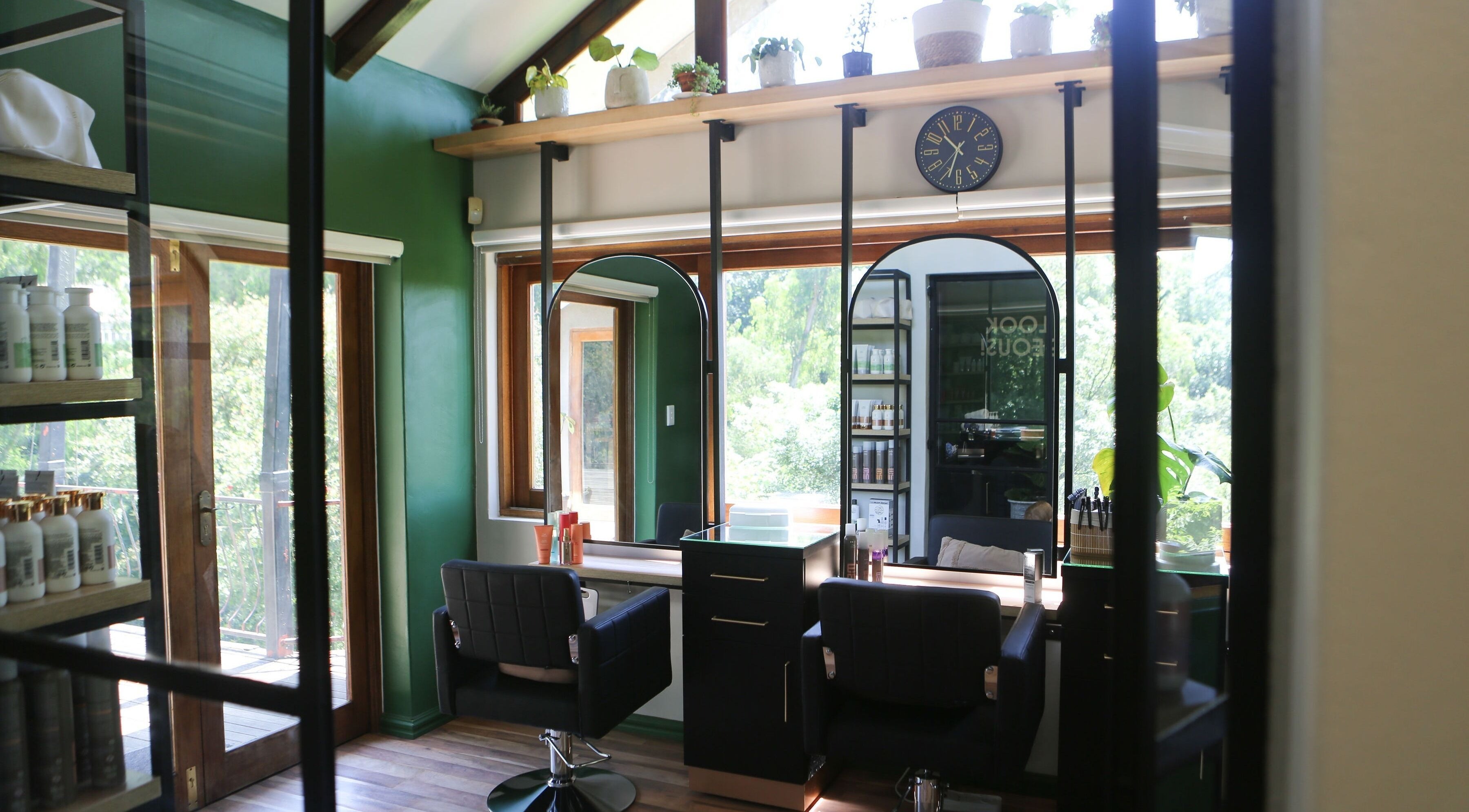 Stylish interior of Hair By Caryn Timms in Pietermaritzburg, Kwazulu-Natal, featuring chic salon chairs.