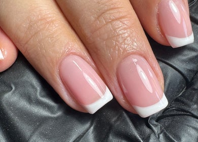 Elegant French manicure by ByMollyJai in Portsmouth, England, GB showcasing glossy, well-shaped nails.