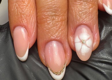 Elegant French nails with floral design at ByMollyJai Treatments & Training, Portsmouth, England, GB.