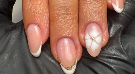 Elegant French nails with floral design at ByMollyJai Treatments & Training, Portsmouth, England, GB.