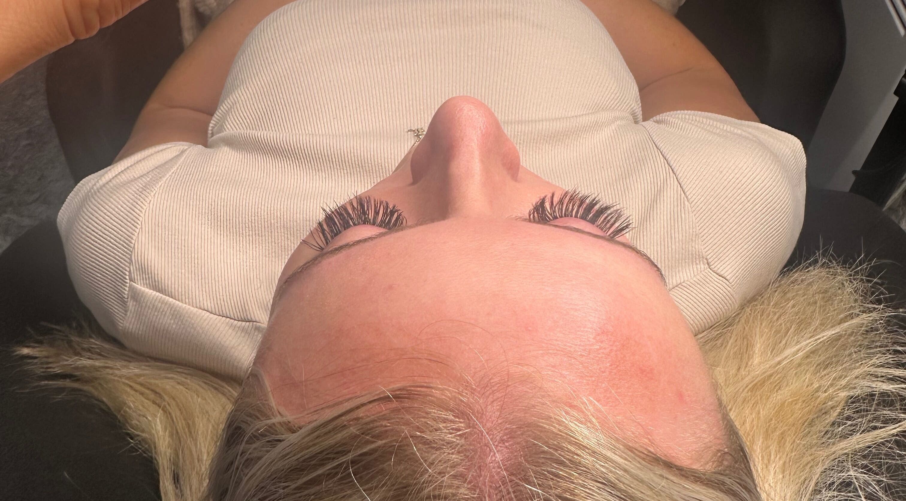 Client with enhanced eyelashes at KS Renewal Space, Hamilton, Waikato, NZ, showcasing beauty treatment.