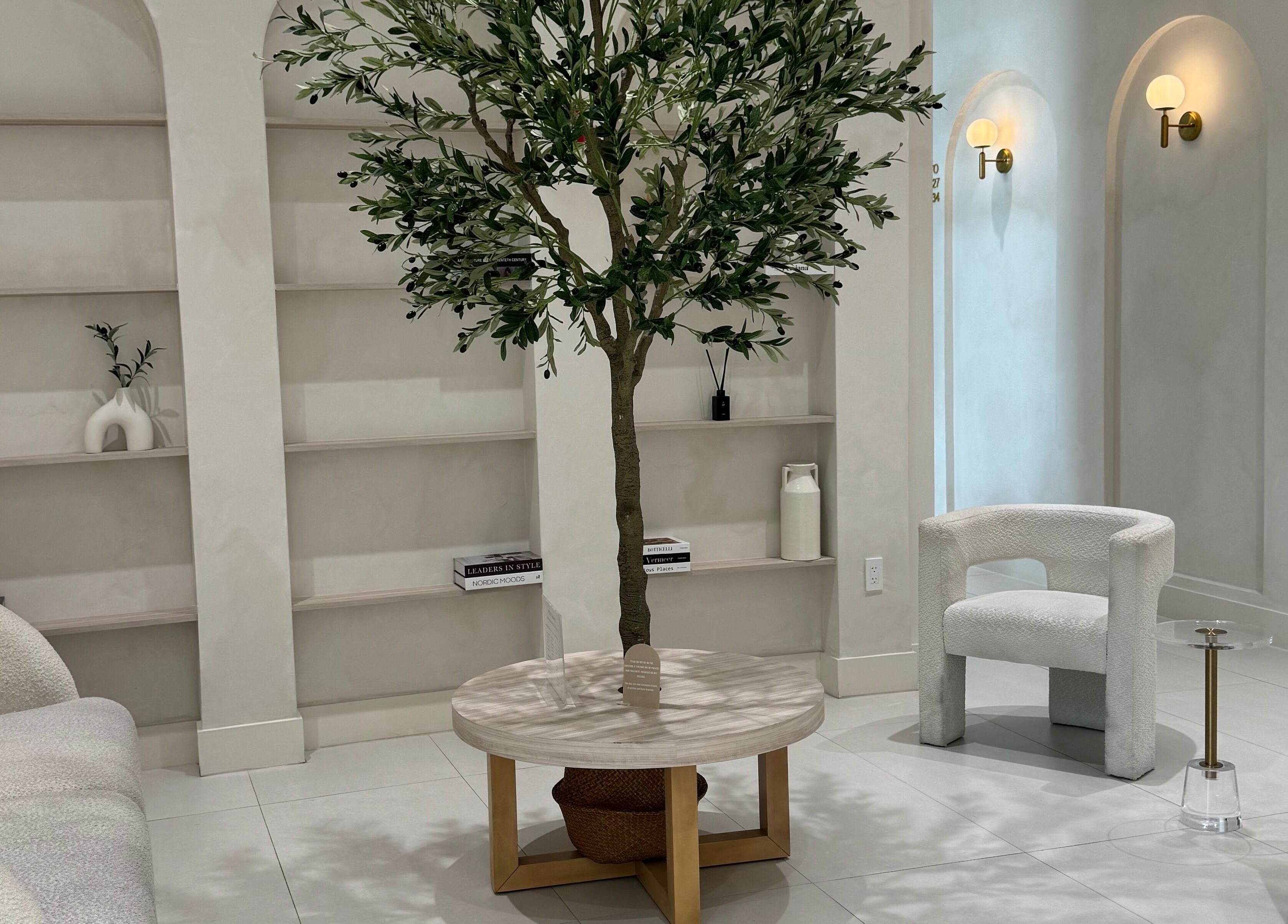 Relaxing lounge at Touch Of Spa By Sol, Pembroke Pines, Florida, US featuring comfy seating and elegant decor.