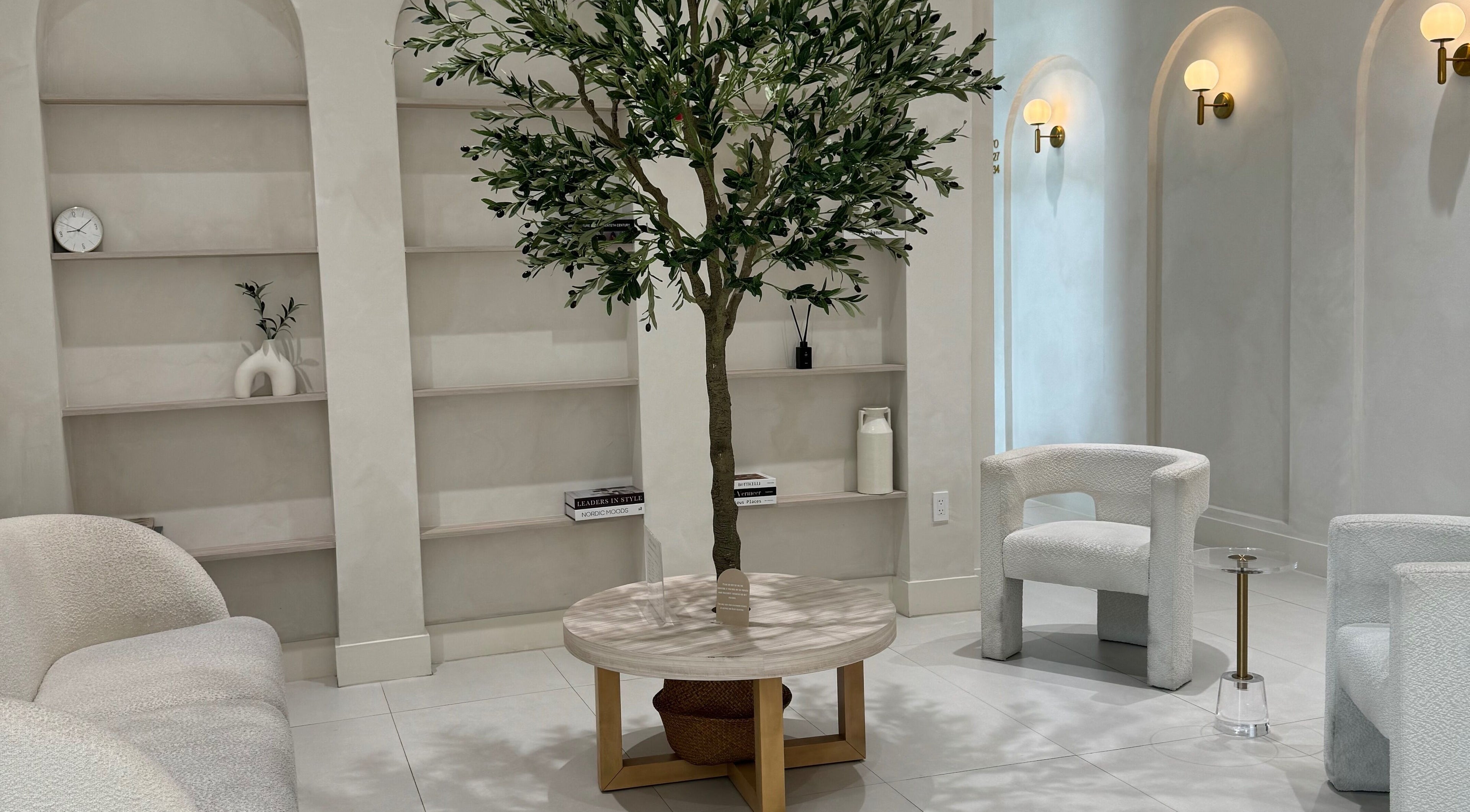 Relaxing lounge at Touch Of Spa By Sol, Pembroke Pines, Florida, US featuring comfy seating and elegant decor.