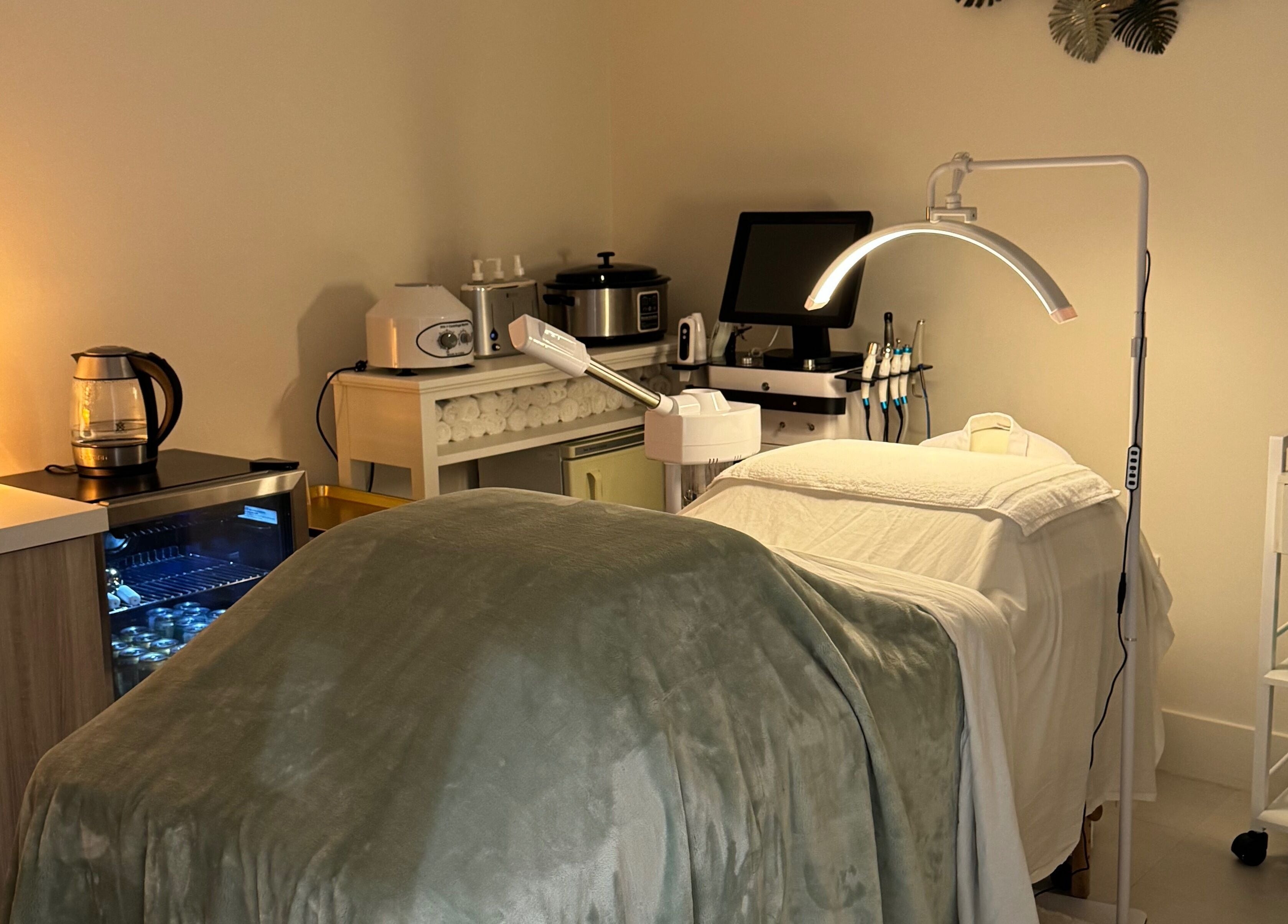 Relaxing treatment room at Touch Of Spa By Sol, Pembroke Pines, Florida, US, featuring spa essentials and equipment.