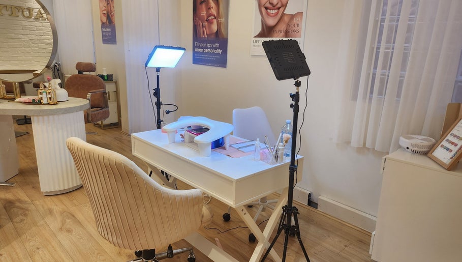 Modern manicure station at Nail Strike, Lane Cove, New South Wales, AU, featuring ambient lighting and plush seating.
