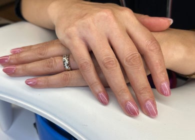 Manicured hands with elegant pink nails at Nail Strike, Lane Cove, New South Wales, AU.