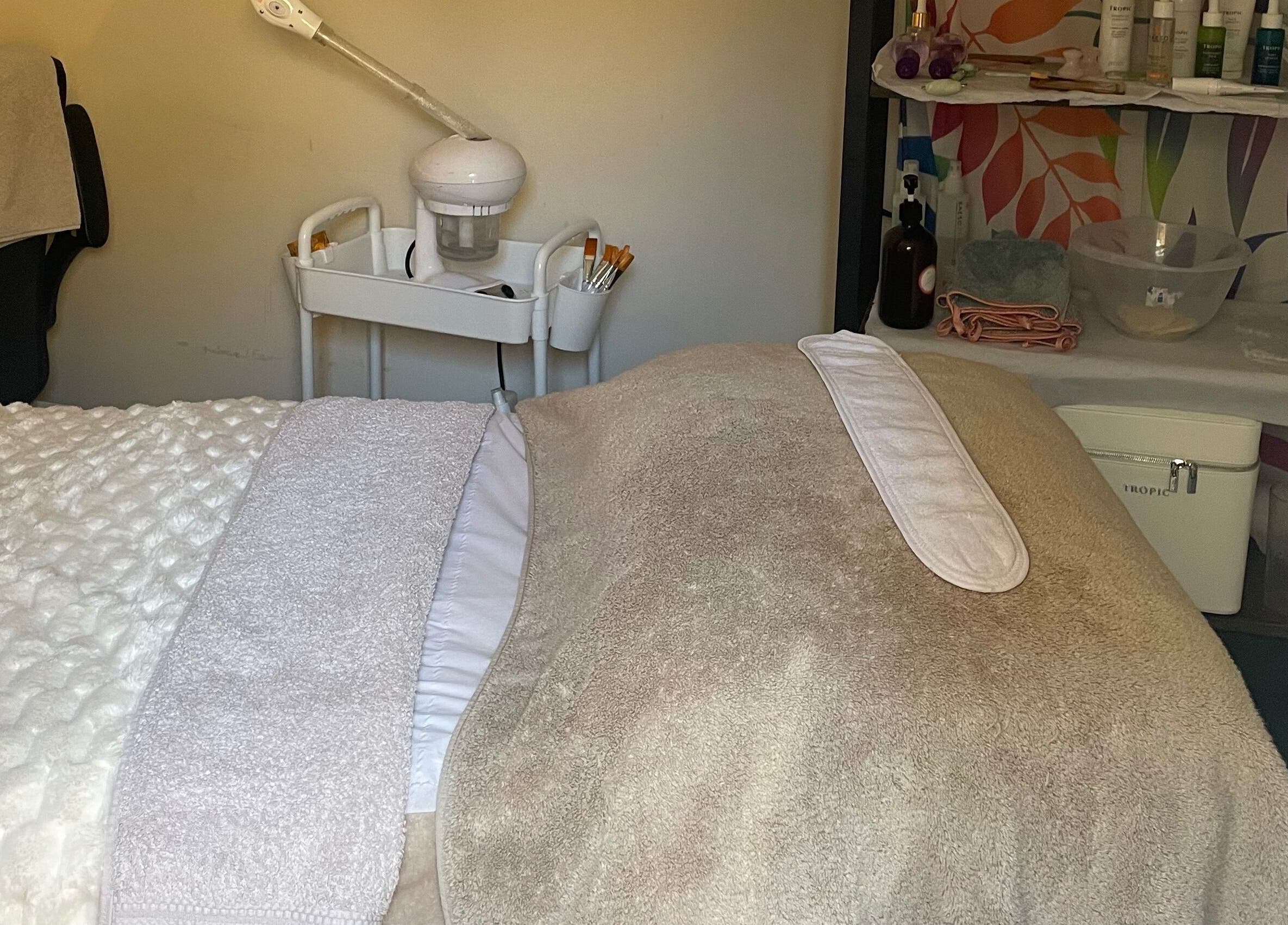 Cozy treatment room at Lillie Rose Beauty in Worthing, England, GB, showcasing relaxation essentials.