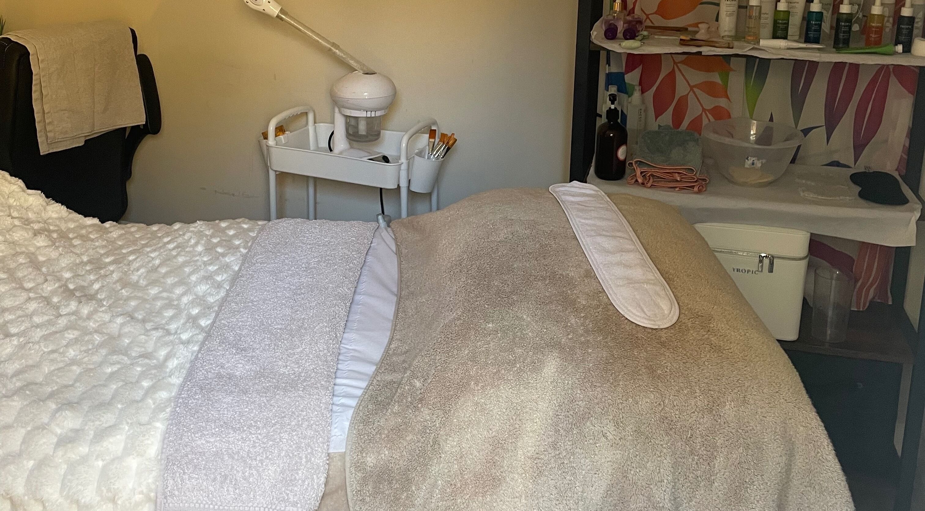 Cozy treatment room at Lillie Rose Beauty in Worthing, England, GB, showcasing relaxation essentials.