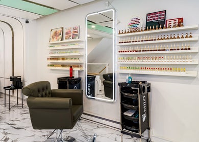 Modern interior of JEUNE ET BELLE BEAUTY SALON in Montréal, Québec, CA showcasing chic styling stations.