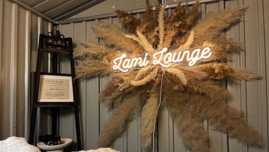Lami Lounge UK signage and decor in Spalding, England, GB, featuring pampas grass and certificate display.