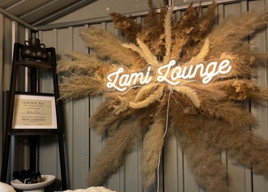 Lami Lounge UK signage and decor in Spalding, England, GB, featuring pampas grass and certificate display.