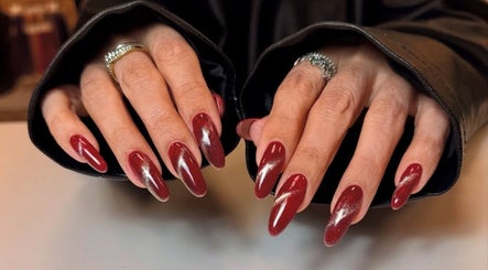 Stylish red and silver sparkly nails at Nailsby.didar, Stockport, England, GB.