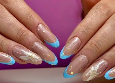 Stylish blue tip nails with gold accents at Nailsby.didar, Stockport, England, GB.