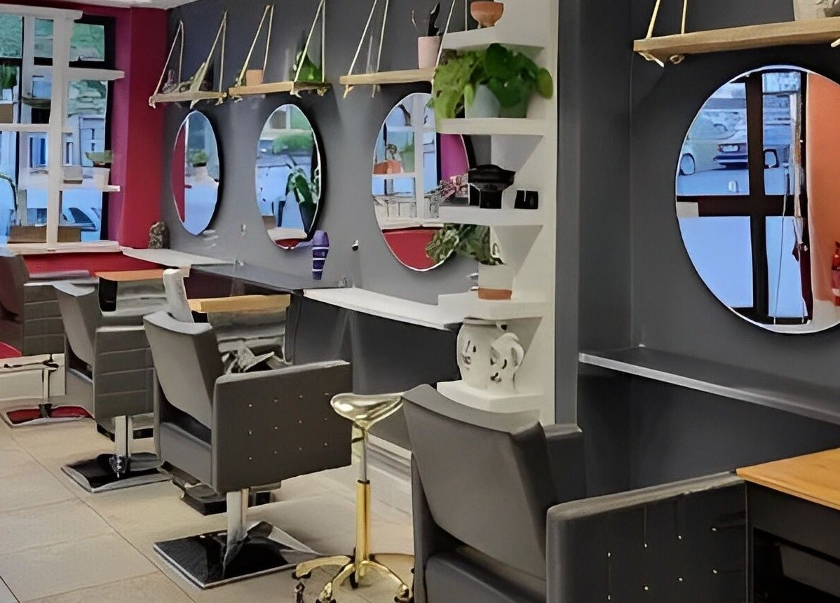 Modern salon chairs and mirrors at Tamed and Wild Fishponds, Bristol, England, GB.